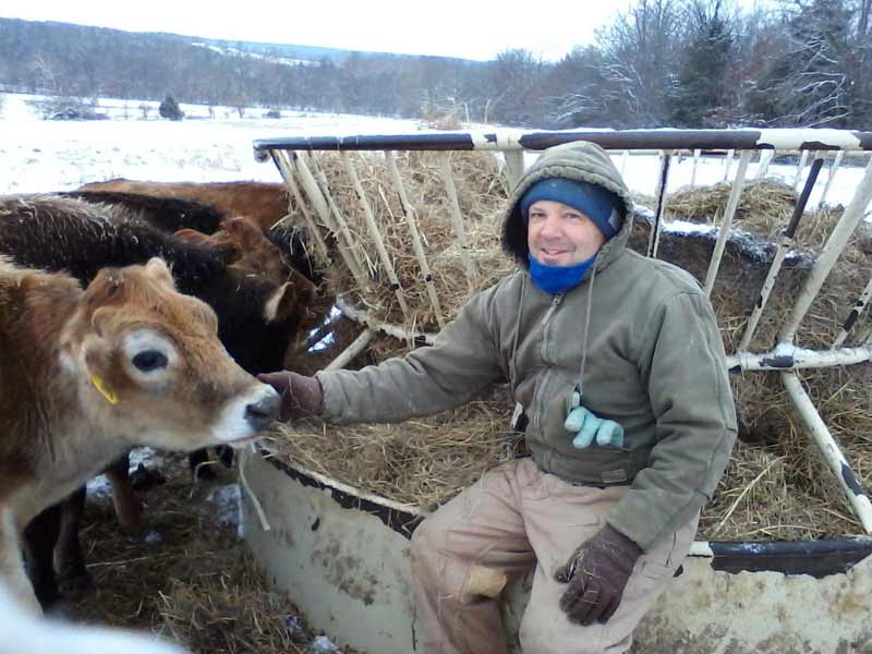 image of farmer feeding livestock